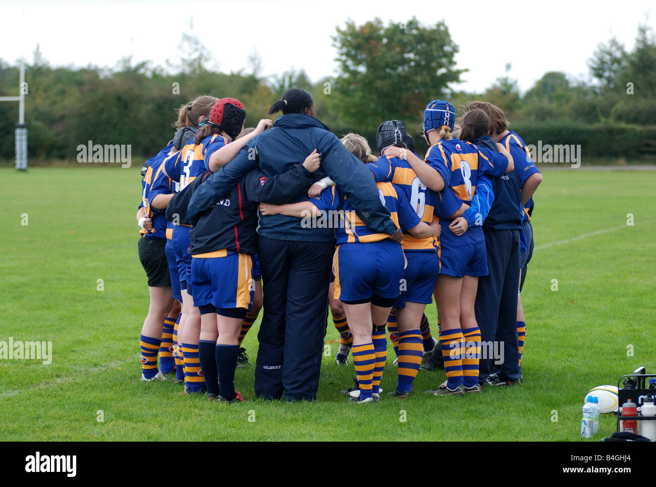 Women rugby players group huddle hires stock photography and images
